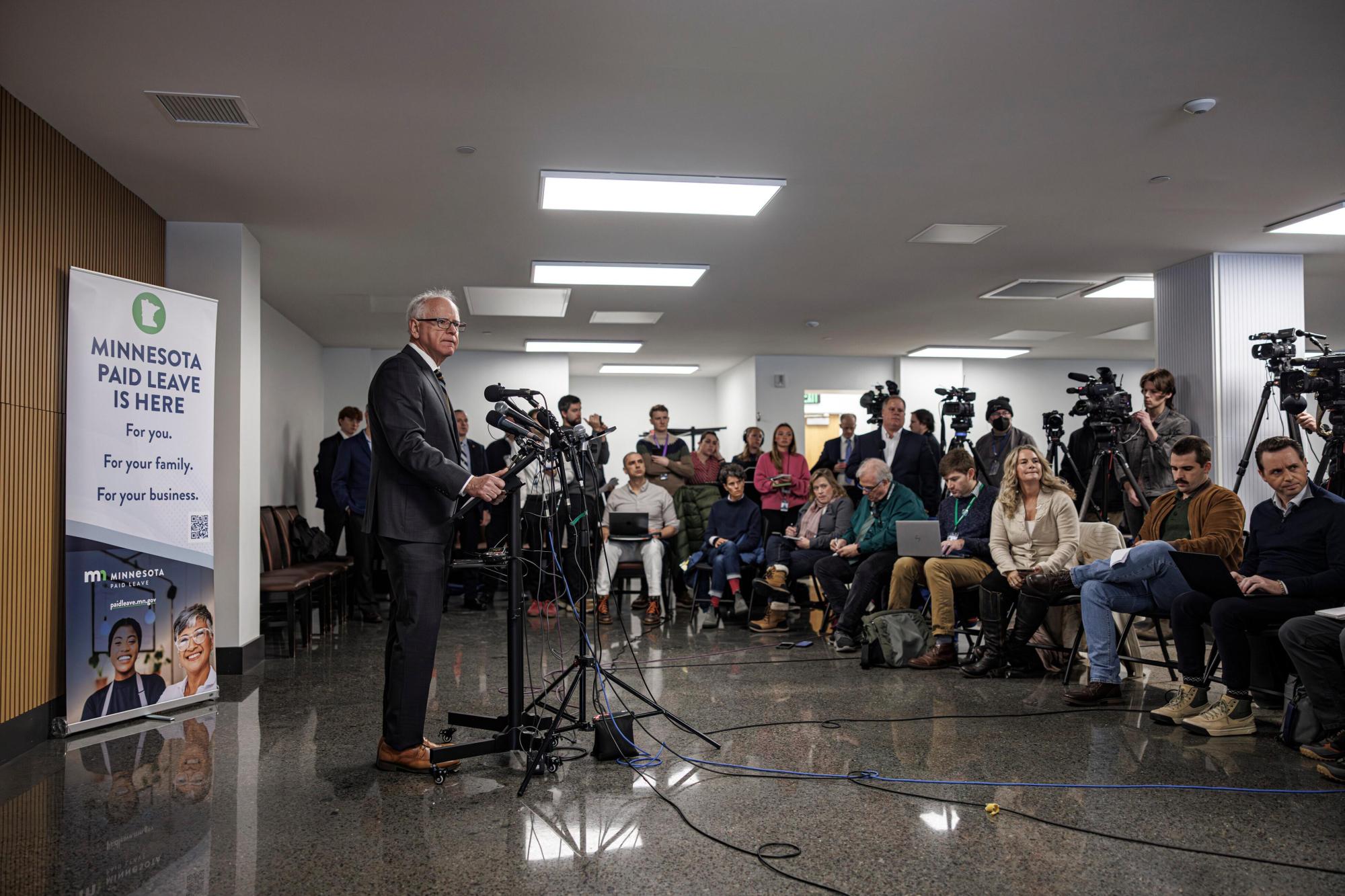 Minnesota Gov. Tim Walz responds to questions from reporters regarding whether he will seek a third term during a press conference following an event on the state’s new Paid Family and Medical Leave program, Tuesday, Jan. 6, 2026, in Minneapolis. (Kerem Yücel/Minnesota Public Radio via AP)
