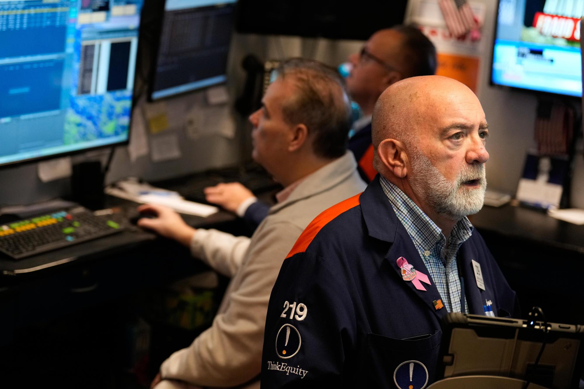 Joseph Stevens works on the floor at the New York Stock Exchange in New York, Tuesday, Jan. 6, 2026. (AP Photo/Seth Wenig)

