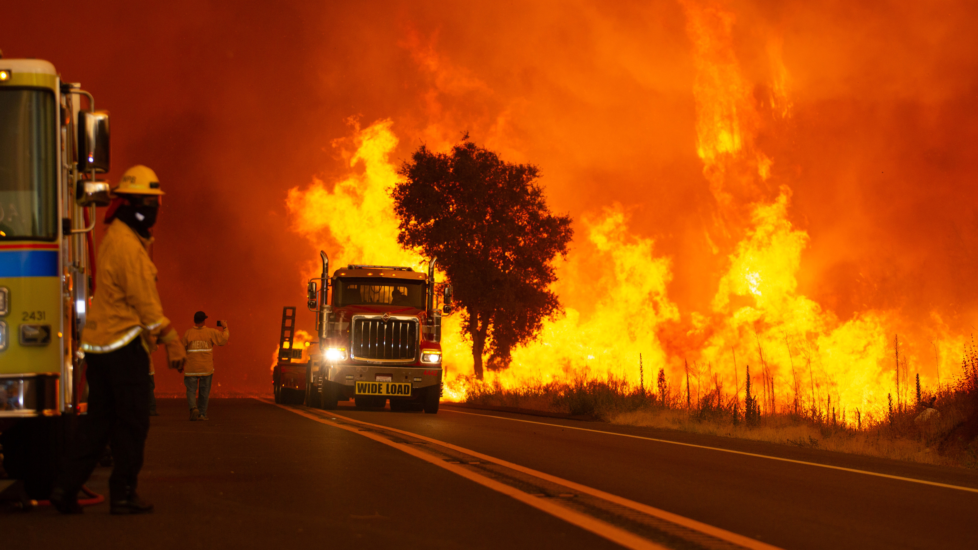 A fire transport truck flees as heavy flames engulf Ortega Highway in the Cleveland National Forest during the Airport Fire in Orange County on Tuesday, Sept. 10, 2024. (Photo by Raphael Richardson, Contributing Photographer)
