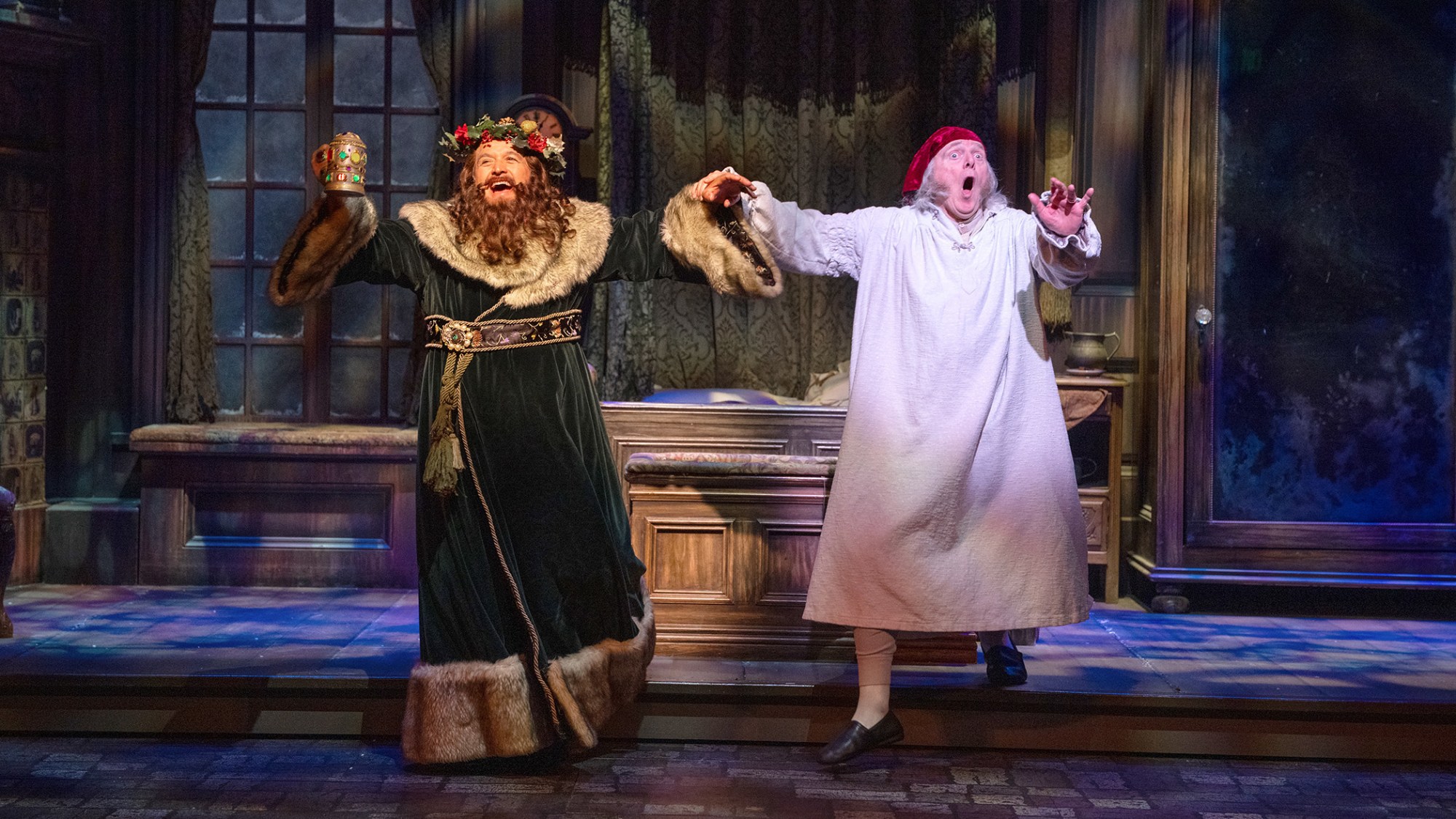 Richard Soto and Richard Doyle appear a scene from South Coast Repertory’s current production of Charles Dickens’ “A Christmas Carol.” The Costa Mesa theater is developing a new version of the holiday classic with playwright Amy Freed. (Photo by Scott Smeltzer, South Coast Repertory)
