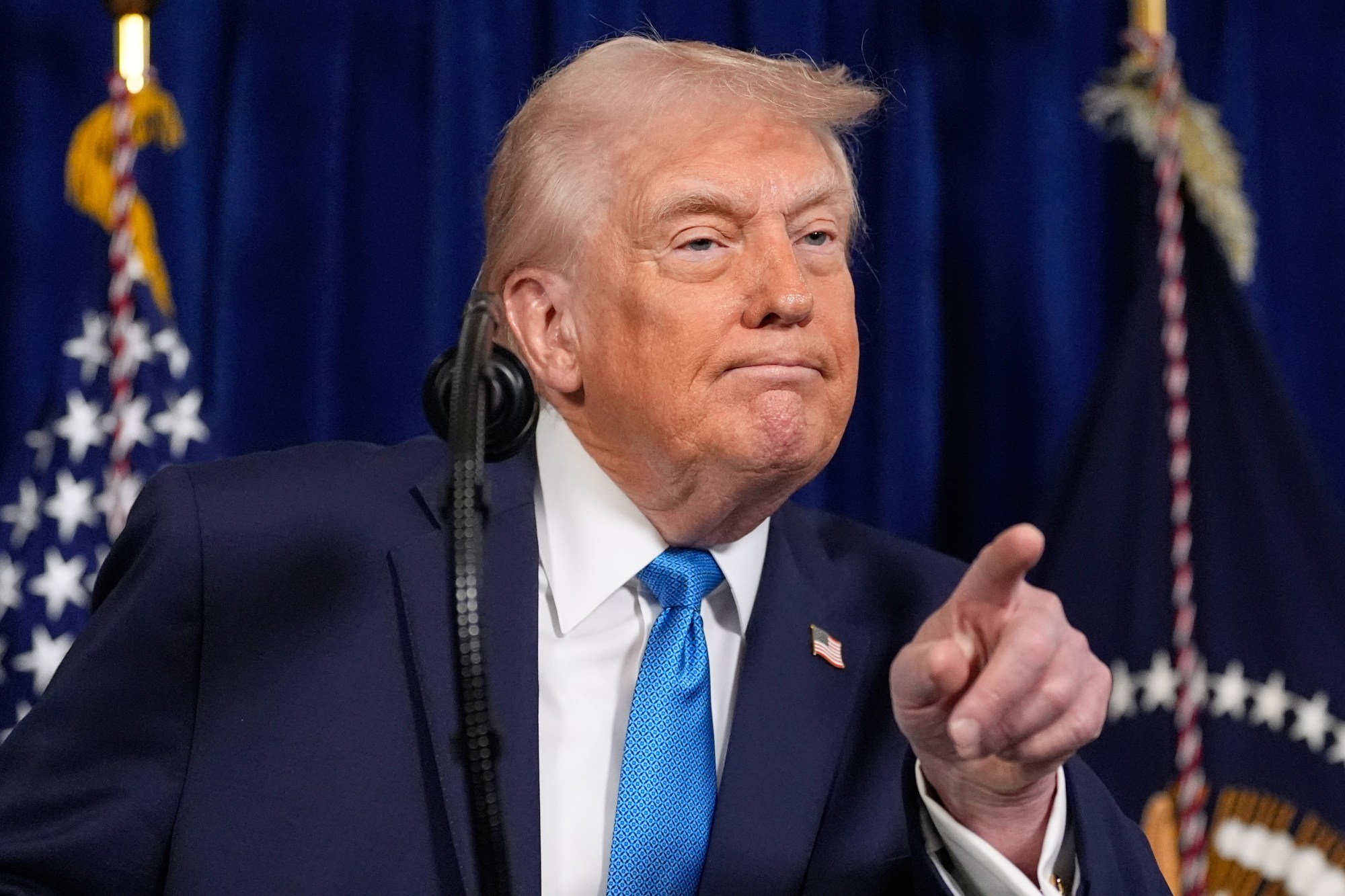 President Donald Trump points to a reporter to ask a question during a news conference at Mar-a-Lago, Saturday, Jan. 3, 2026, in Palm Beach, Fla. (AP Photo/Alex Brandon)

