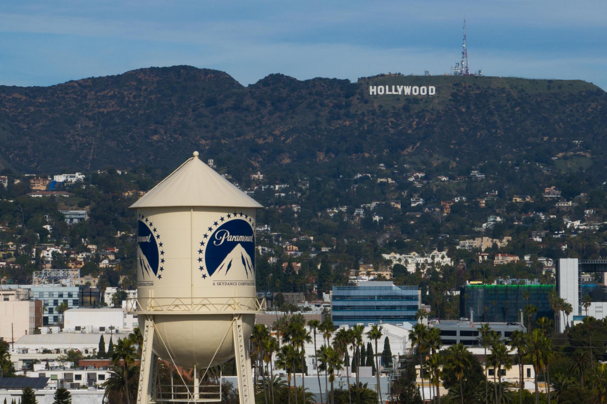 The Paramount Pictures water tower is seen in Los Angeles, Thursday, Dec. 18, 2025, with the Hollywood sign in the distance. (AP Photo/Jae C. Hong)
